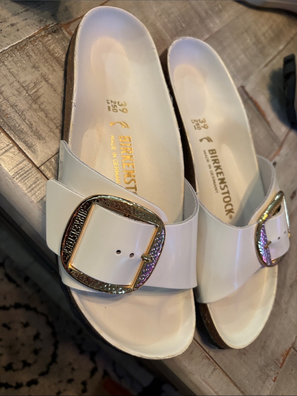 Birkenstock White Patent Madrid Slide Sandals with Iridescent Gold Buckle